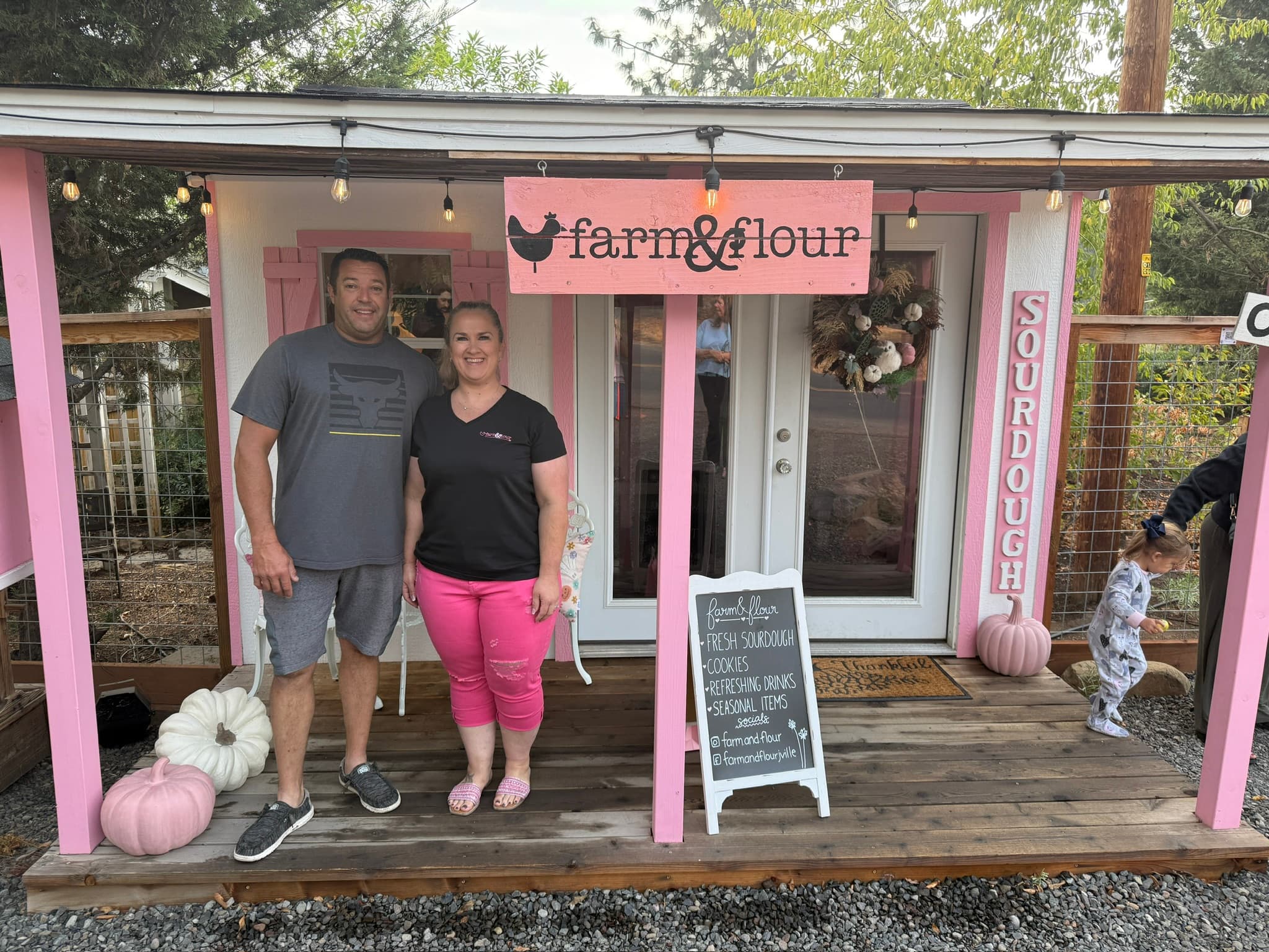 Melanie from Farm & Flour smiling beside fresh bread